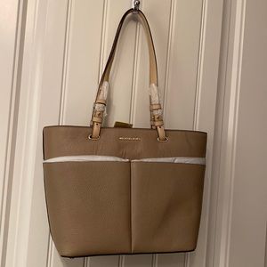 New with tags!! Medium-sized pocket tote. Truffle colored. Michael Kors